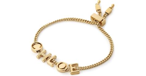 Chloé Letter Charm Bracelet in Metallic | Lyst