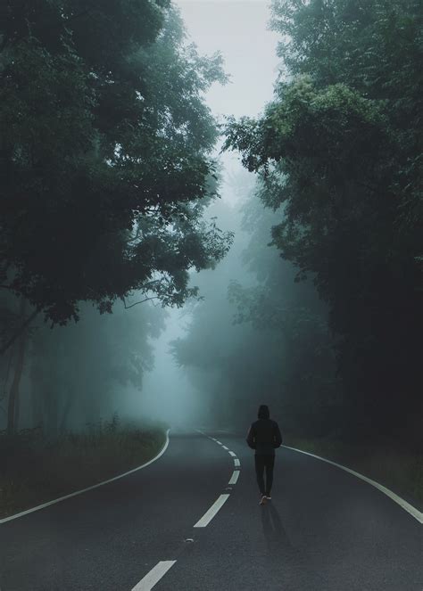 man wearing black hoodie and pants walking on gray top road, #D0DDE2 | Nature iphone wallpaper ...