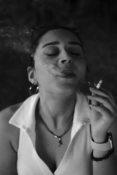 Woman Smoking a Cigarette in Black and White · Free Stock Photo