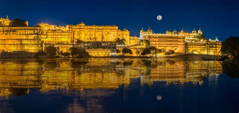 Architecture Masterprize Winner Panorama of City Palace, Udaipur at Night with Moon.