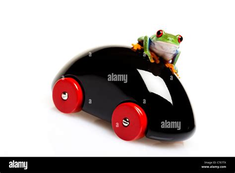 Car toy and crazy frog Stock Photo - Alamy