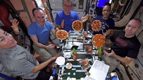 Astronauts make, fling, float, eat pizzas on space station