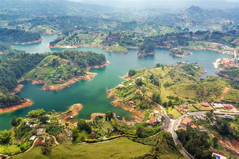 Guatape Lake Photograph by Jess Kraft - Fine Art America