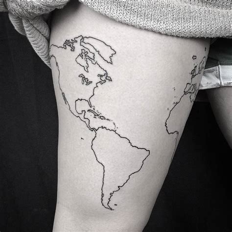 World map outline tattoo on the right thigh.