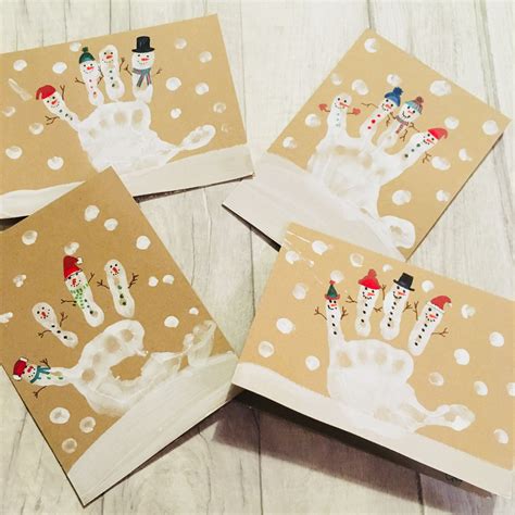 Snowmen handprint toddler Christmas card. We had great fun making these as… | Artesanato ...