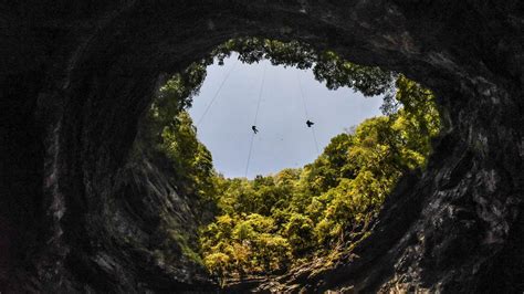 Chinese scientists discovered a cluster of 54 giant karst sinkholes, known as “tian keng” in ...