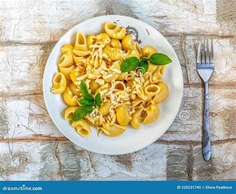 Pasta in the Form of Large Snails with Grated Cheese and Basil Stock ...