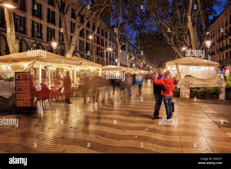 La Rambla (Las Ramblas) boulevard at night in Barcelona, city landmark and main pedestrian ...