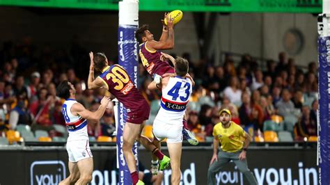 AFL round 11: Callum Ah Chee snares hanger during Brisbane Lions ...