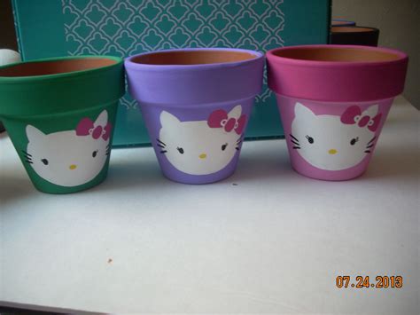 hello kitty pots | Clay pot crafts, Light bulb ornaments, Clay pots