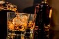 Man pouring whiskey from a decanter - Free Stock Image