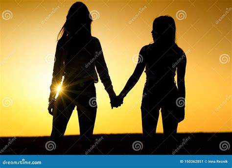 Two Girls Holding Hands Silhouette