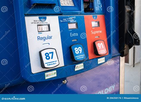 A Rack with Pumps with Different Types of Fuel at Esso Gas Station ...