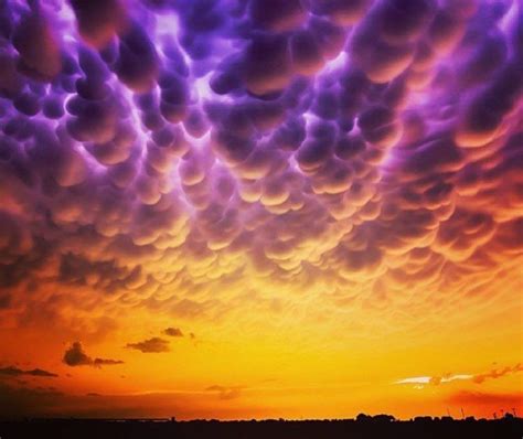 Mammatus lit by lightning in a golden sunset. | Mammatus clouds, Earth pictures, Clouds