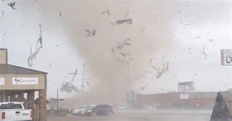 Tornado tears through Arkansas city, prompting curfew and National Guard response