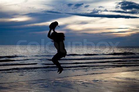 Silhouette girl on beach | Stock image | Colourbox