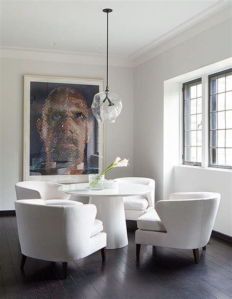 A transparent pendant light ensures the statement-making artwork is the center of attention ...