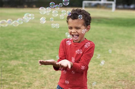 "Kid Playing: Happy Kid" by Stocksy Contributor "PER Images" - Stocksy