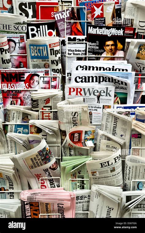 Newspapers and magazines in a rack, UK Stock Photo - Alamy