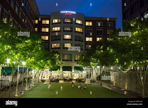 GREENVILLE, SC (USA) - July 5, 2019: An after-dark view of the downtown Marriott Courtyard hotel ...