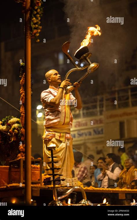 Ganga aarti, Portrait of an young priest performing river ganges ...