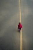 A child walking alone at the r | Tensor.Art