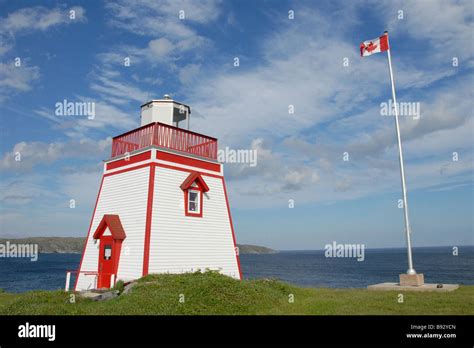 Lighthouse and Canadian Flag St Anthony Newfoundland Canada Stock Photo - Alamy