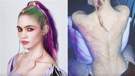 Grimes Shows Off New Tattoo of "Beautiful Alien Scars"