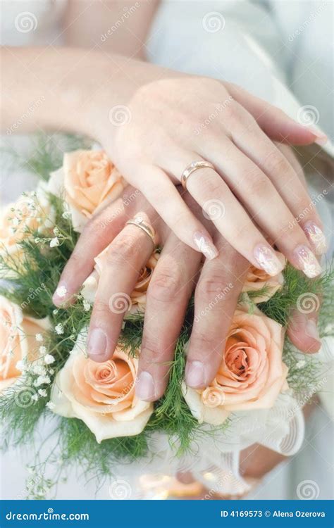 Hands With Wedding Rings Stock Photos - Image: 4169573