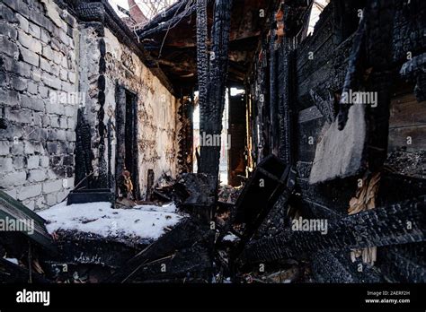 Consequences of fire. Completely burnt old rural house Stock Photo - Alamy