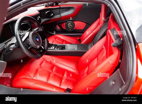 Novosibirsk, Russia - 05.29.2019: Interior of a sports car Marussia B1 of red color with elegant ...