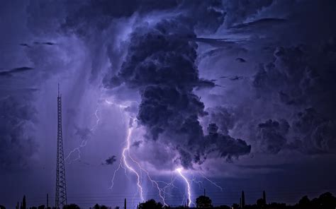 a lightning storm is seen over the city