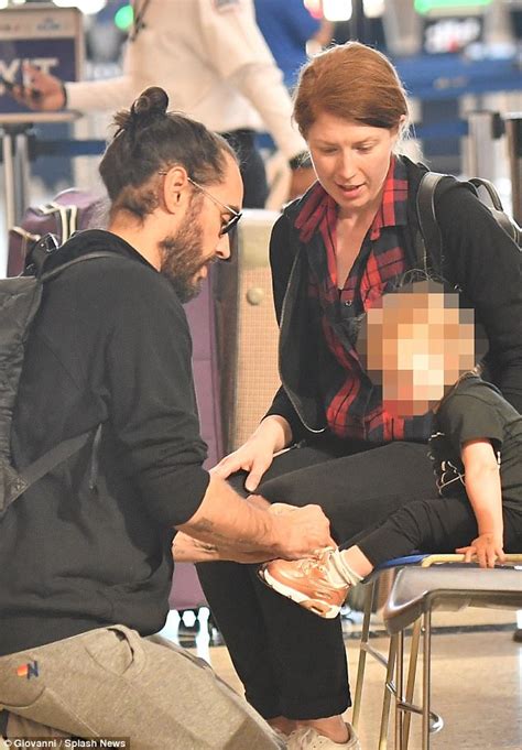 Russell Brand plays with daughter Mabel at airport | Daily Mail Online