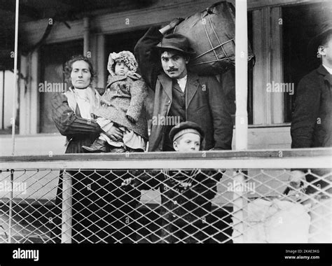 Italian immigrant family on ferry, leaving Ellis Island 1905 by Hine Lewis Wickes Stock Photo ...