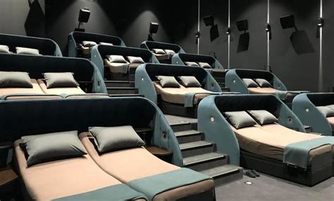 Reclining seats are passe’ – This movie hall has decadent double beds ...