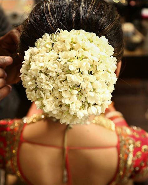 Gajra goes famously well with Silk Sarees and Wedding Lehenga | Indian bride hairstyle, Indian ...