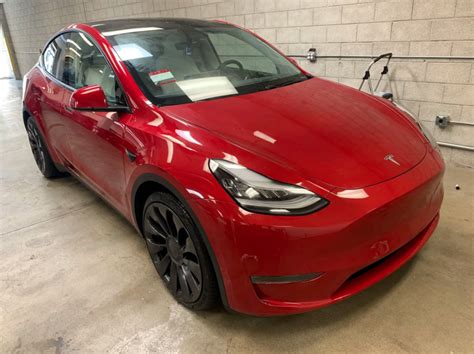 Check out the first red Tesla Model Y's with white interiors delivered over the weekend [Video ...