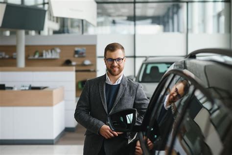 Premium Photo | Portrait of a handsome salesman in the suit standing ...