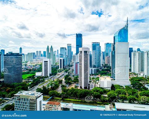 Aerial View of Jakarta Downtown Skyline with High-Rise Buildings with White Clouds and Blue Sky ...