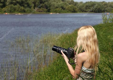 Girl photographer on the nature. — Stock Photo © yykkaa #6470355