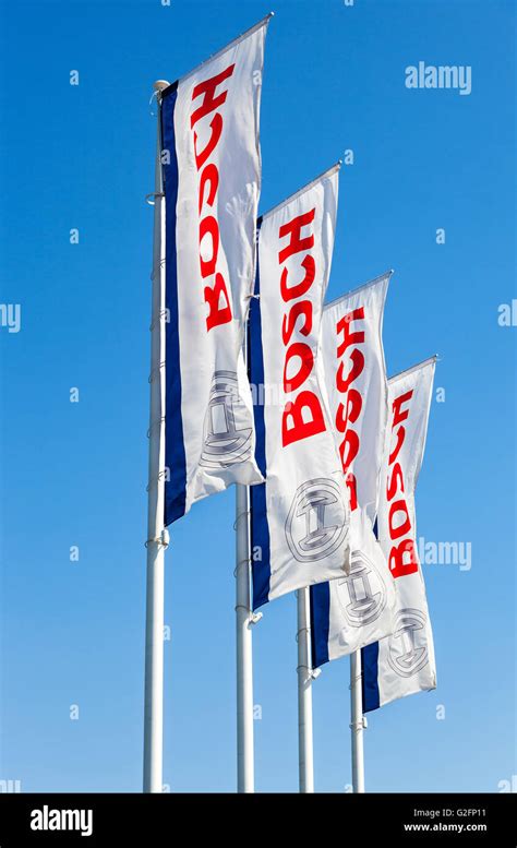 Flags with emblem Bosch against the blue sky Stock Photo - Alamy