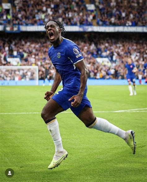 a soccer player is running on the field with his mouth open and eyes ...