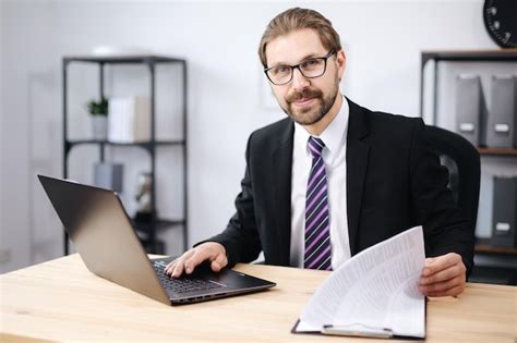 Premium Photo | Happy man using laptop at office