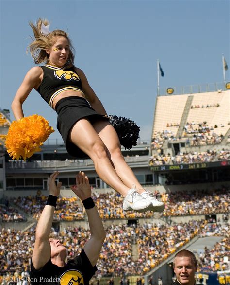 Iowa hawkeyes cheerleaders, Iowa hawkeye football, Cheerleading