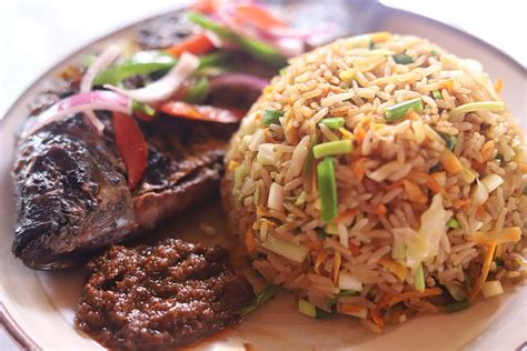 Jollof Rice with Grilled Tilapia – TimberGardensRestaurant.com