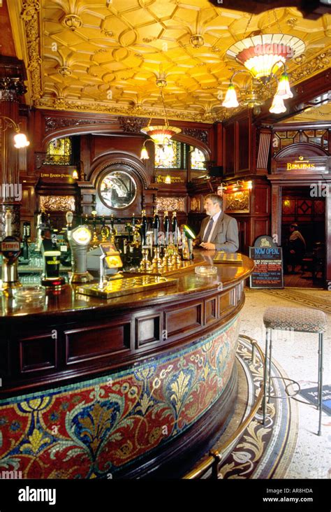 The Philharmonic Pub on Hope Street, Liverpool, Merseyside. Customer at the highly ornate mosaic ...