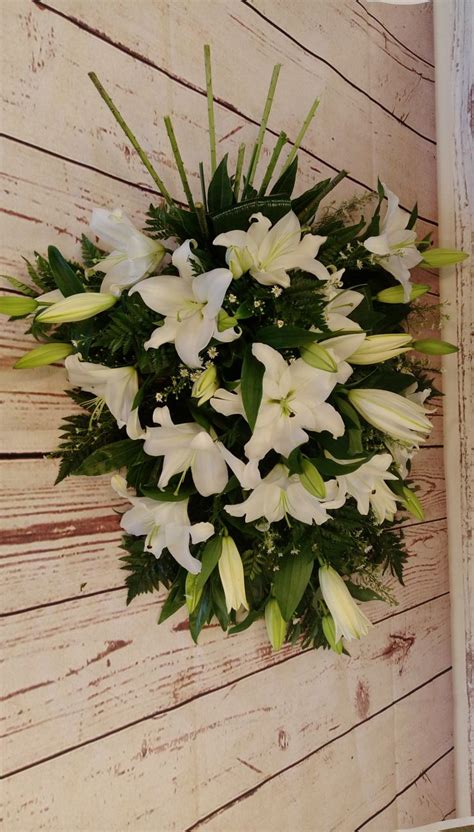 White lily spray | Funeral flowers, White lilies, Flowers