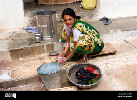 Khajuraho Village: Young Lady Washing Clothes Stock Photo - Alamy