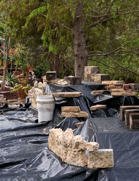 Pond Construction with Material Stacked Up in Different Places Stock Photo - Image of fountain ...