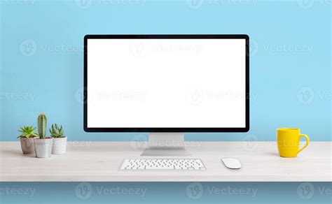 Computer display with white isolated screen for presentation on work desk. Clean composition ...